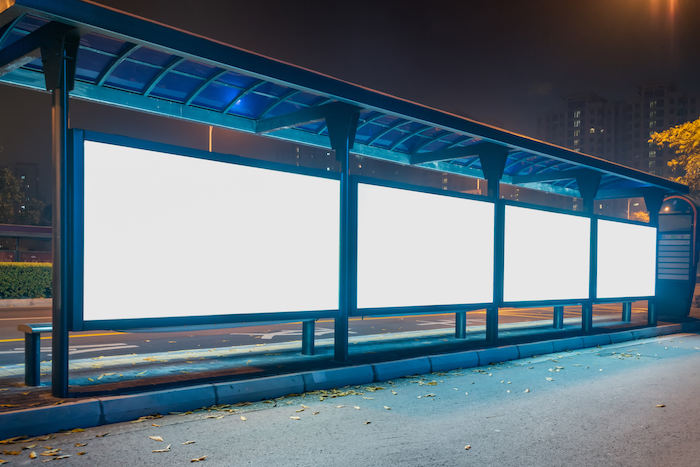 Blank billboard at bus stop in city of China.